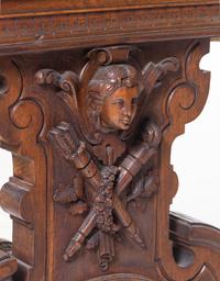 A Swiss Cylinder Music Box in a Carved Walnut Case and Stand