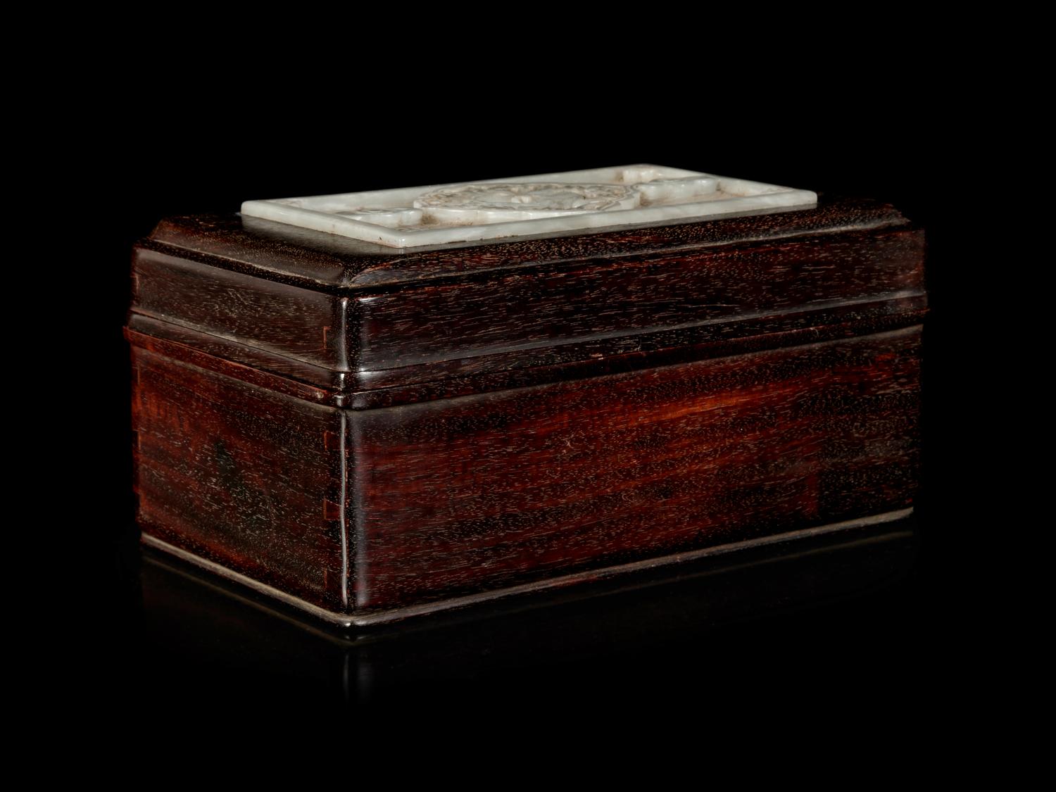 A Chinese White Jade Inset Zitan wood Covered Box