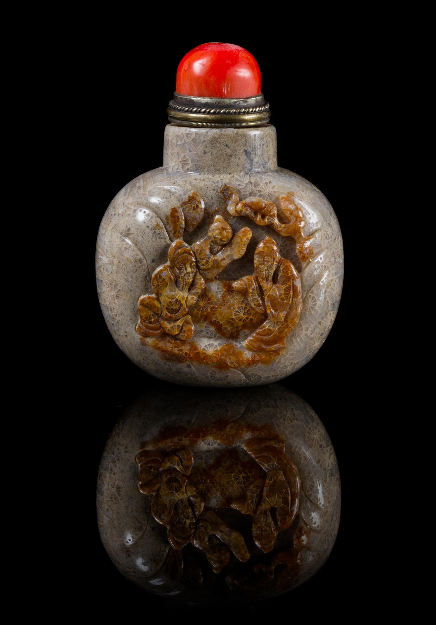 A Carved Hardstone Snuff Bottle Height 3 3/8 inches.