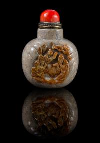 A Carved Hardstone Snuff Bottle Height 3 3/8 inches.
