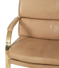 A Set of Twelve Gilt Steel Dining Chairs with Leather Upholstery