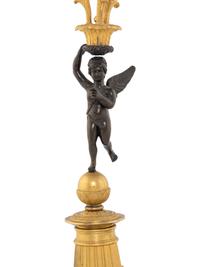 A Pair of Empire Style Gilt and Patinated Bronze Figural Candelabra
