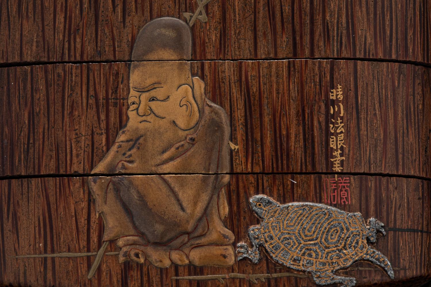 A Japanese Gold and Brown Lacquered Wood Two-Case Inro