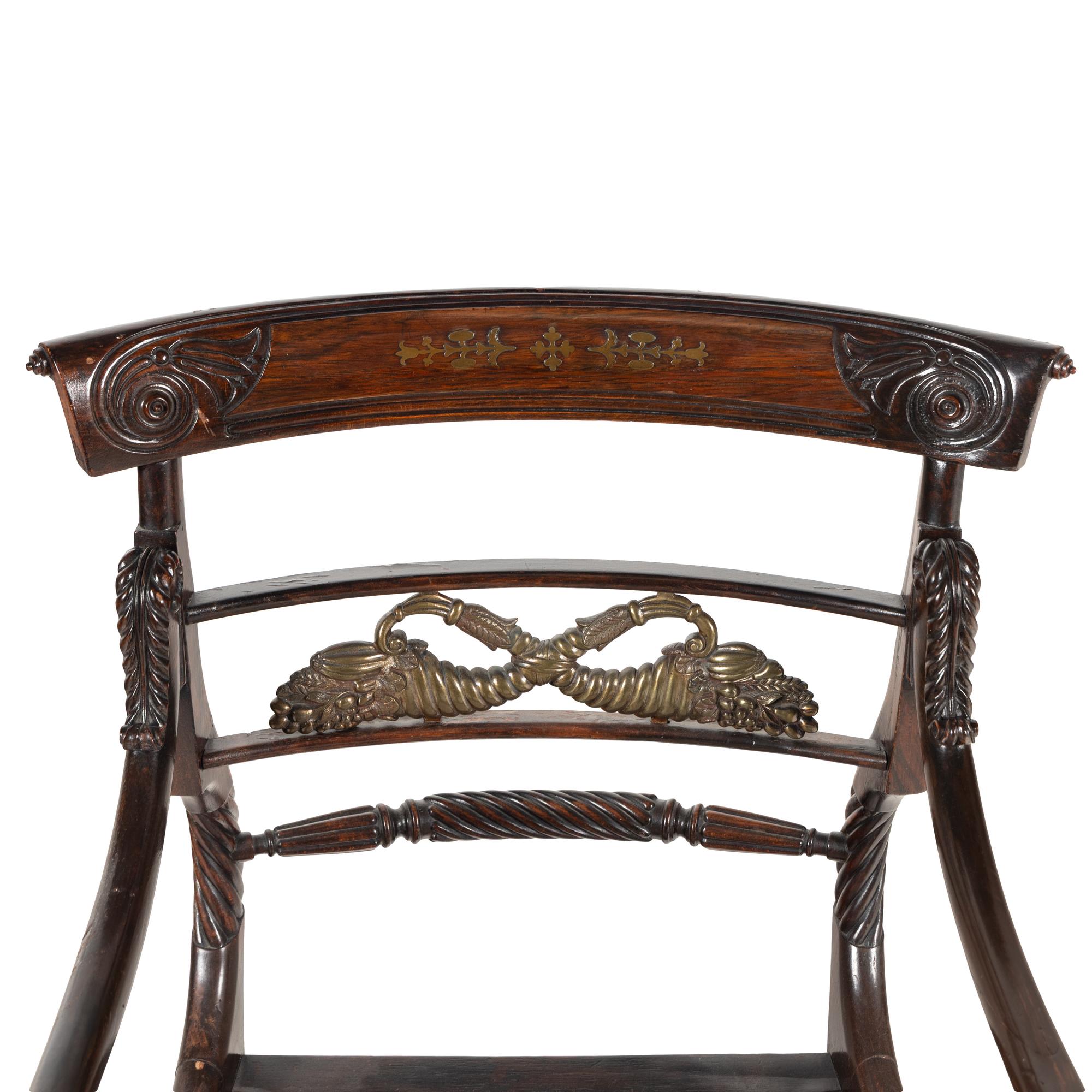 A Regency Rosewood, Mahogany and Brass Armchair