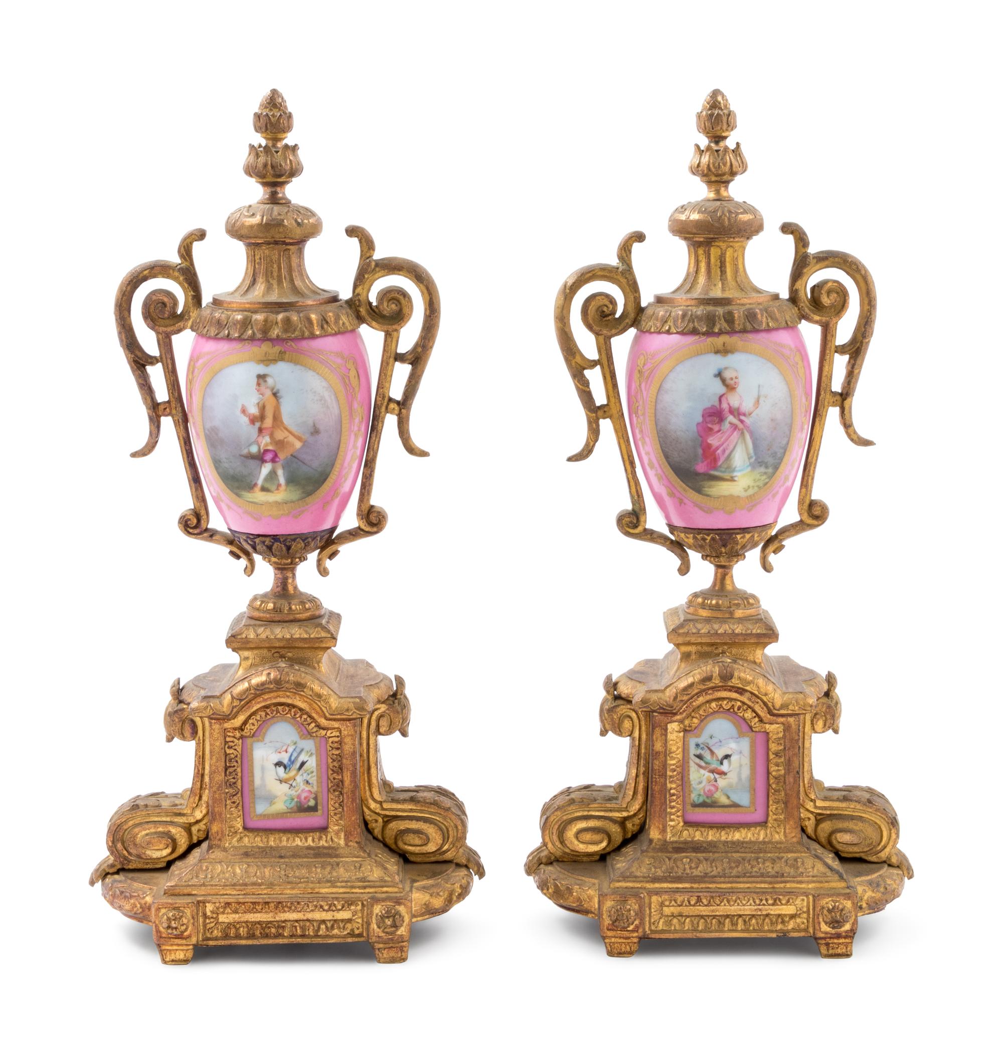 A Pair of Sèvres Style Gilt Metal Mounted Painted Porcelain Ornaments