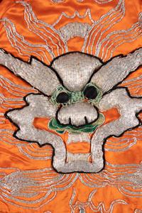 Two Chinese Orange Ground Embroidered Silk Theatrical Robes and A Cape