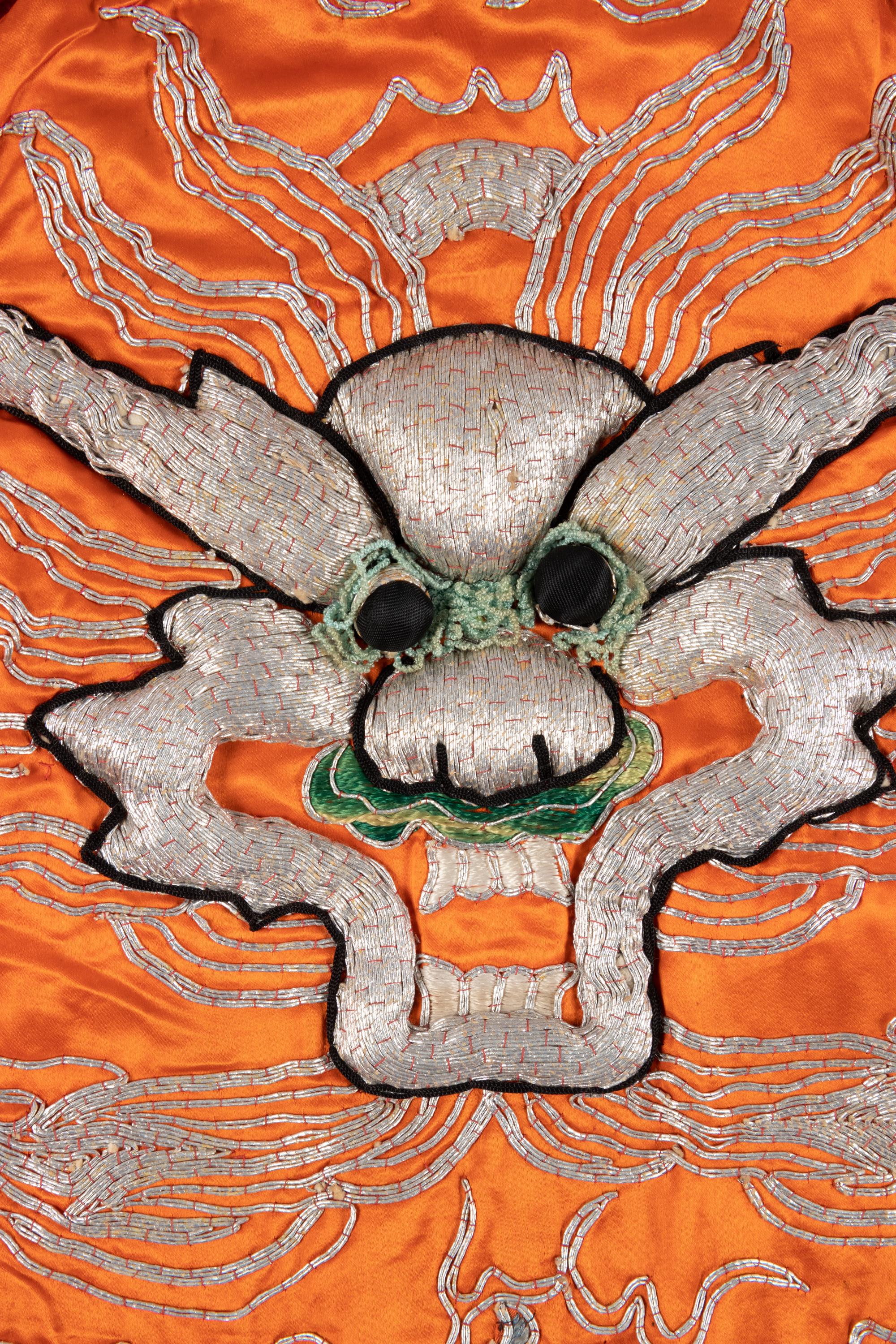 Two Chinese Orange Ground Embroidered Silk Theatrical Robes and A Cape