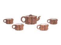 A Chinese Yixing Zisha Pottery Teapot and Four Teacups