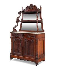 A Rococo Revival Carved Rosewood Marble-Top Serving Cabinet