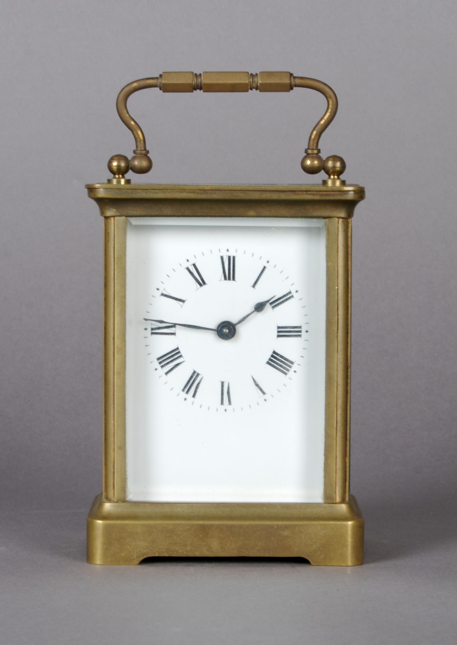 A Brass Carriage Clock, Height 4 3/4 inches.