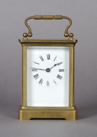 A Brass Carriage Clock, Height 4 3/4 inches.