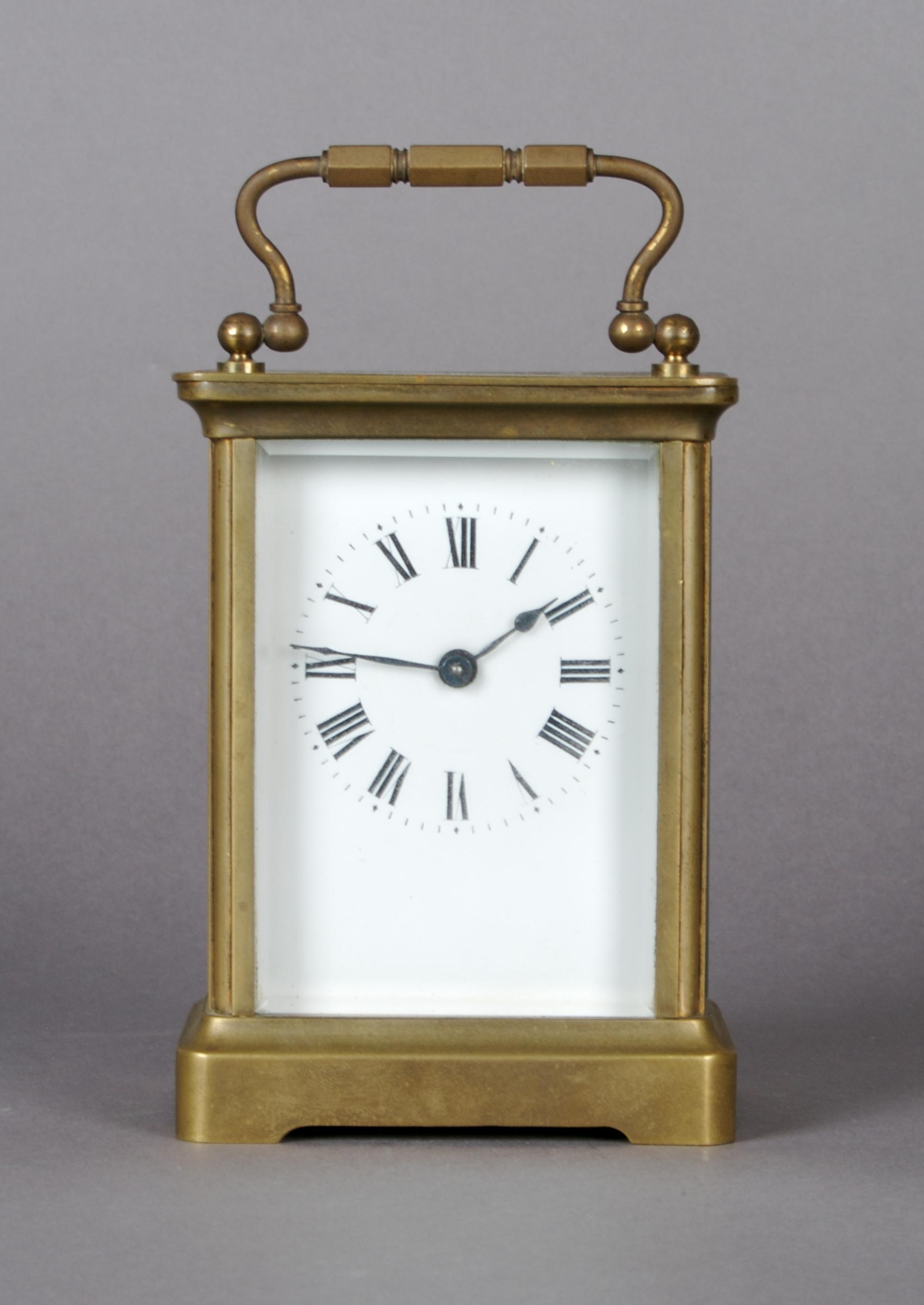 A Brass Carriage Clock, Height 4 3/4 inches.