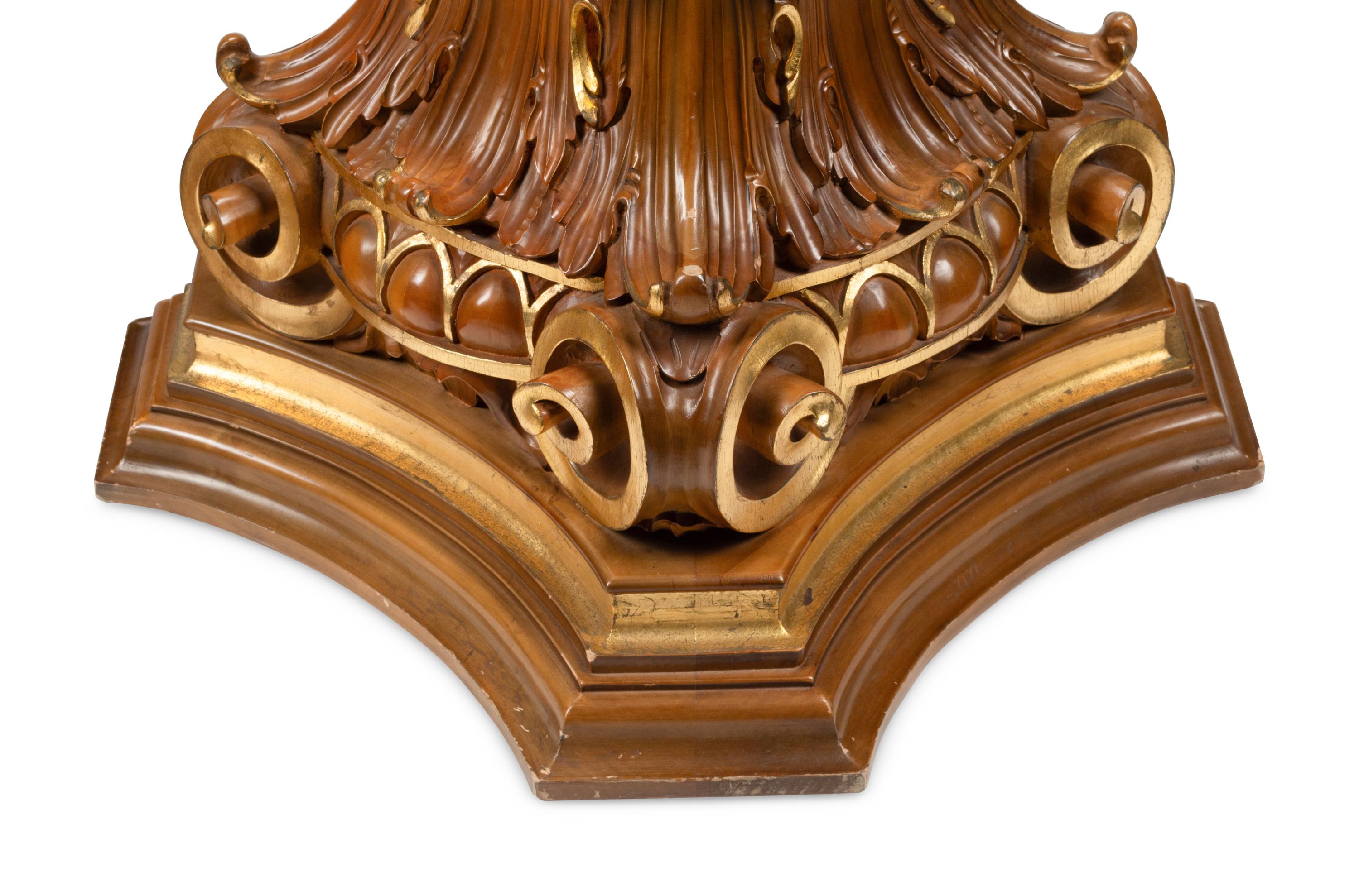 A Pair of Italian Carved and Parcel Gilt Column Capitals