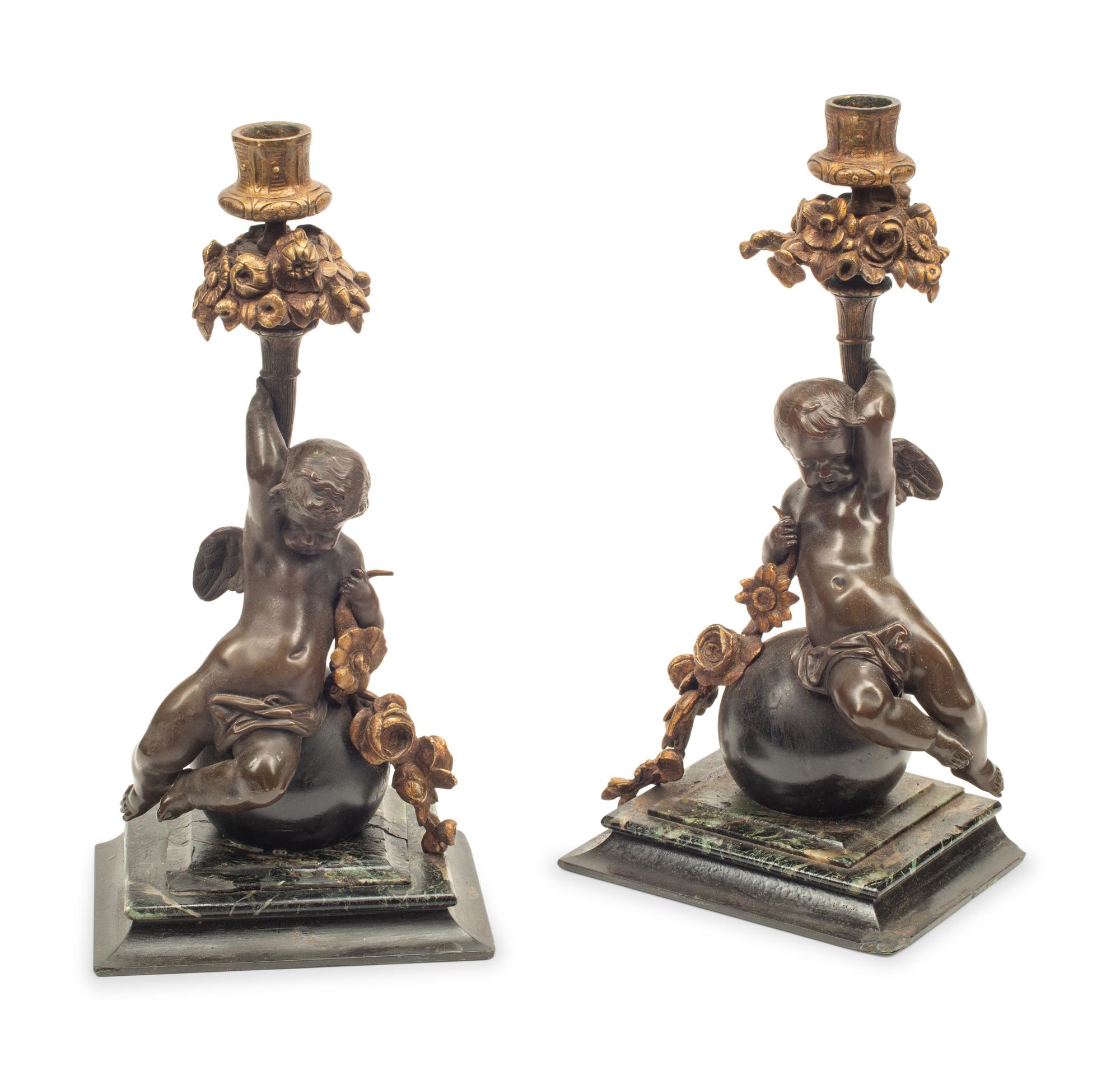 A Pair of Continental Gilt and Patinated Bronze and Marble Figural Candlesticks
