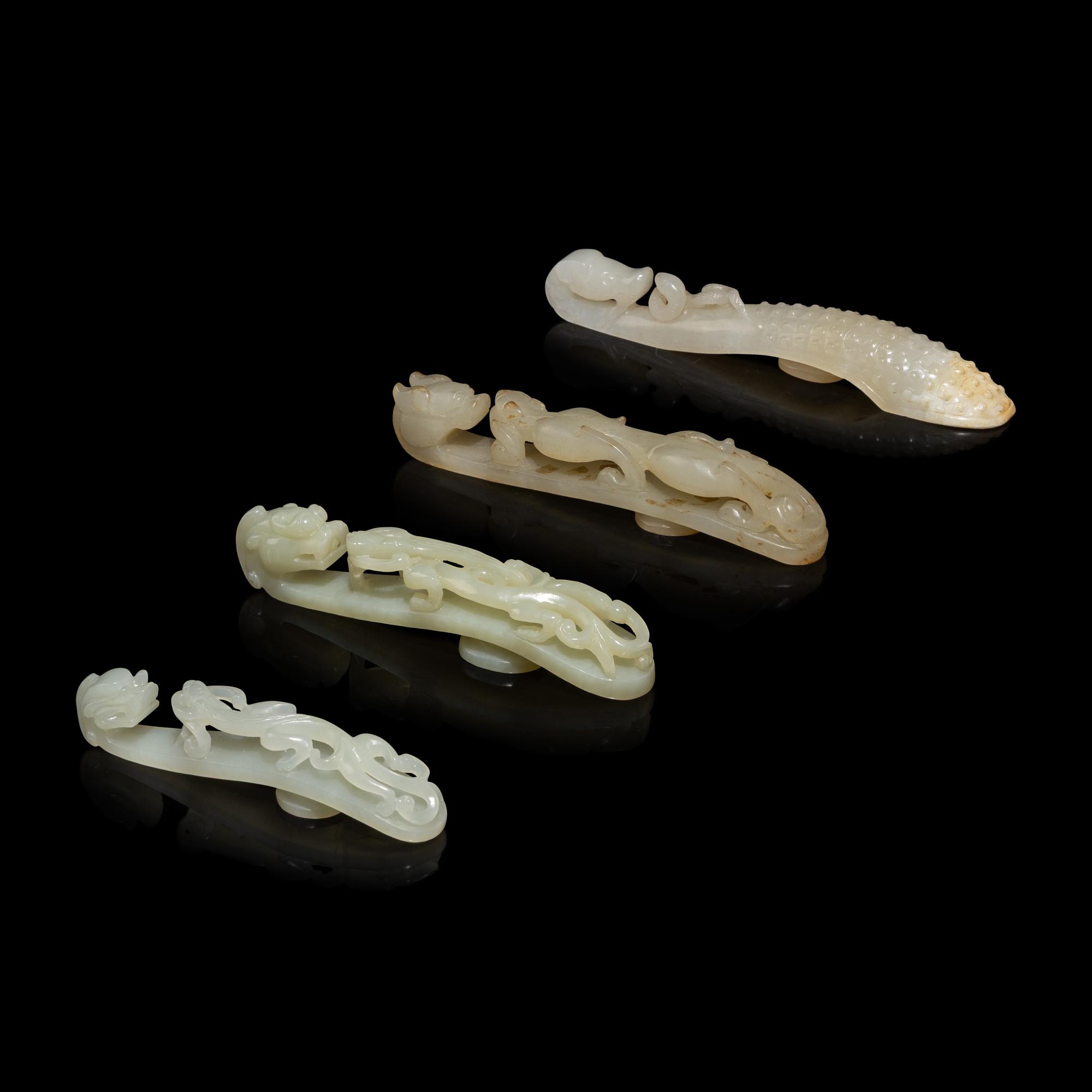 Four Chinese Pale Celadon Jade 'Dragon' Belt Hooks, Daigou — 青白玉龍鈎四枚