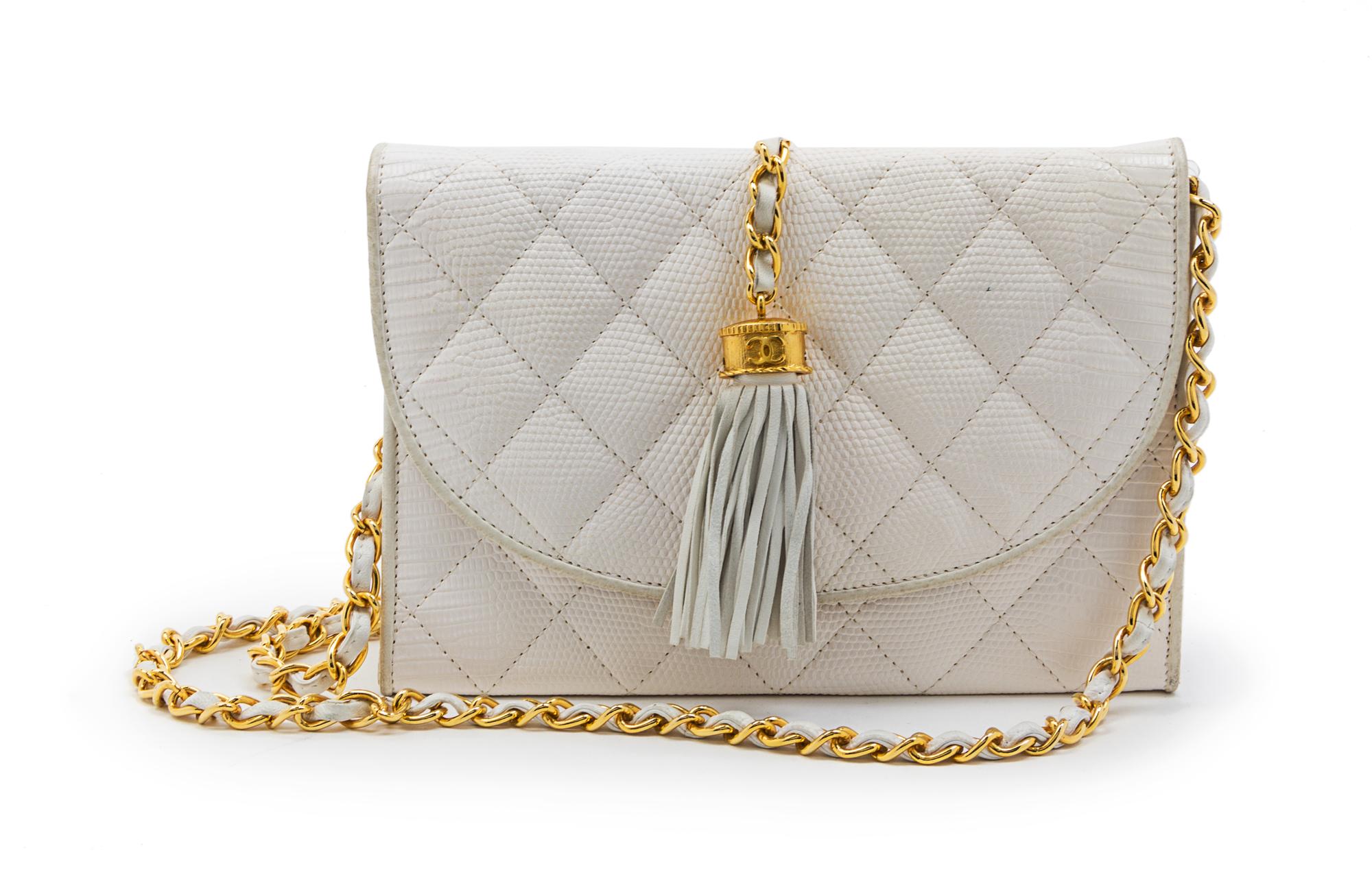 A Chanel White Quilted Lizardskin Bag, 8 x 5 1/2 x 2 1/2 inches.