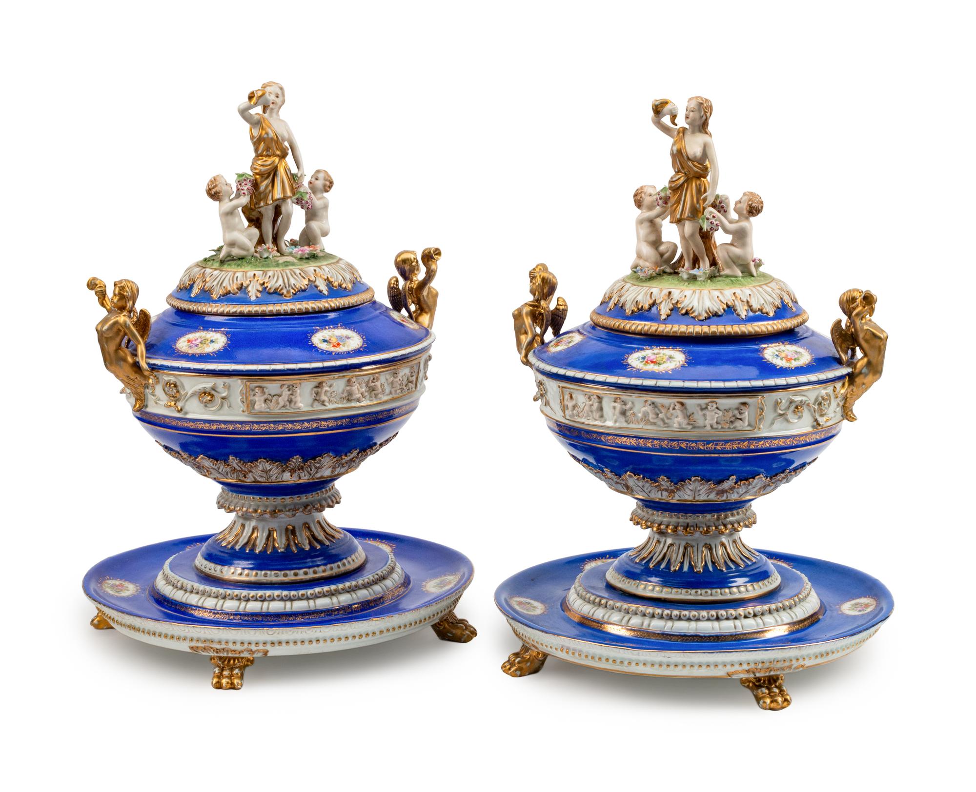 A Pair of German Porcelain Tureens, Covers and Stands