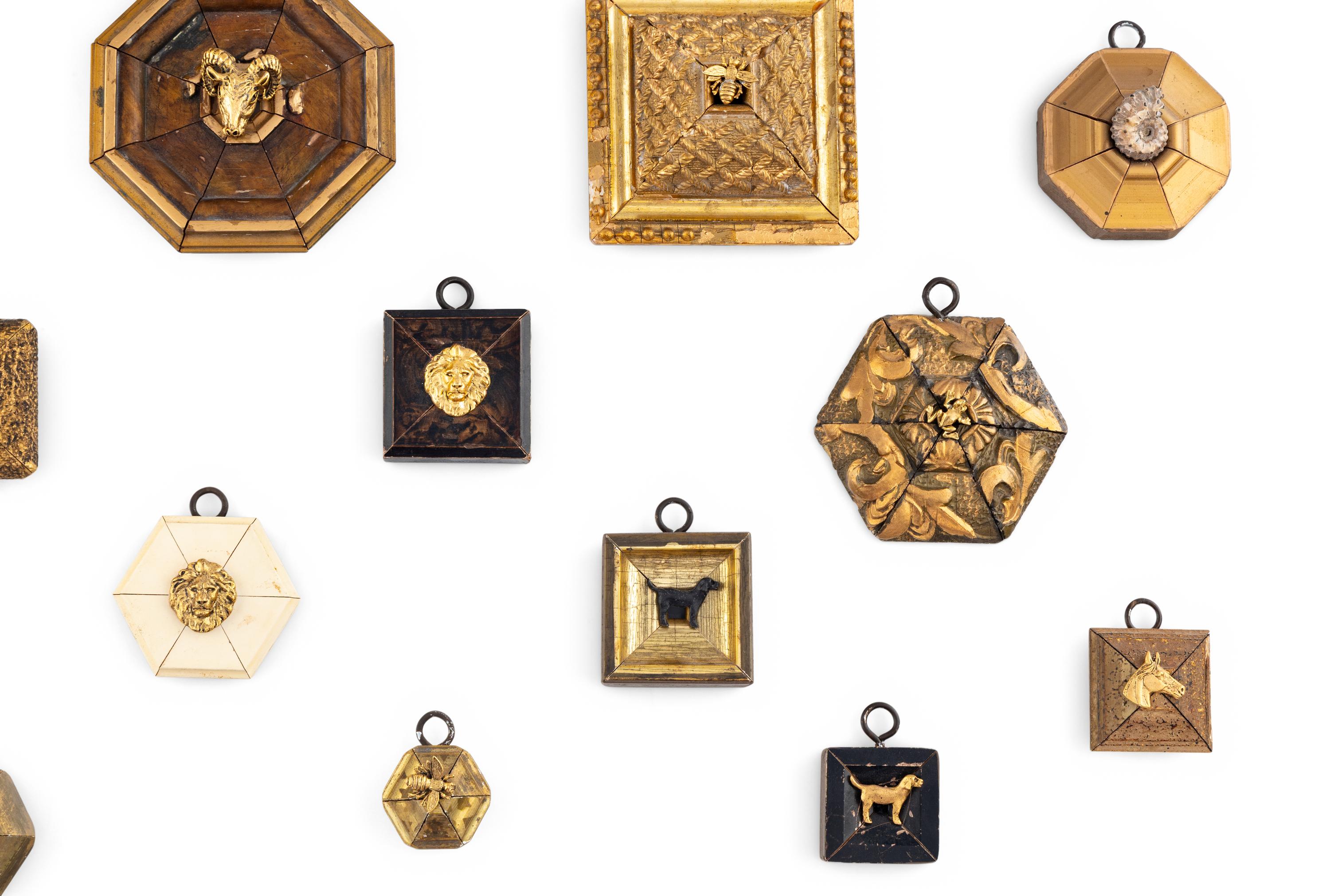 A Collection of Framed Metal Animal Figures