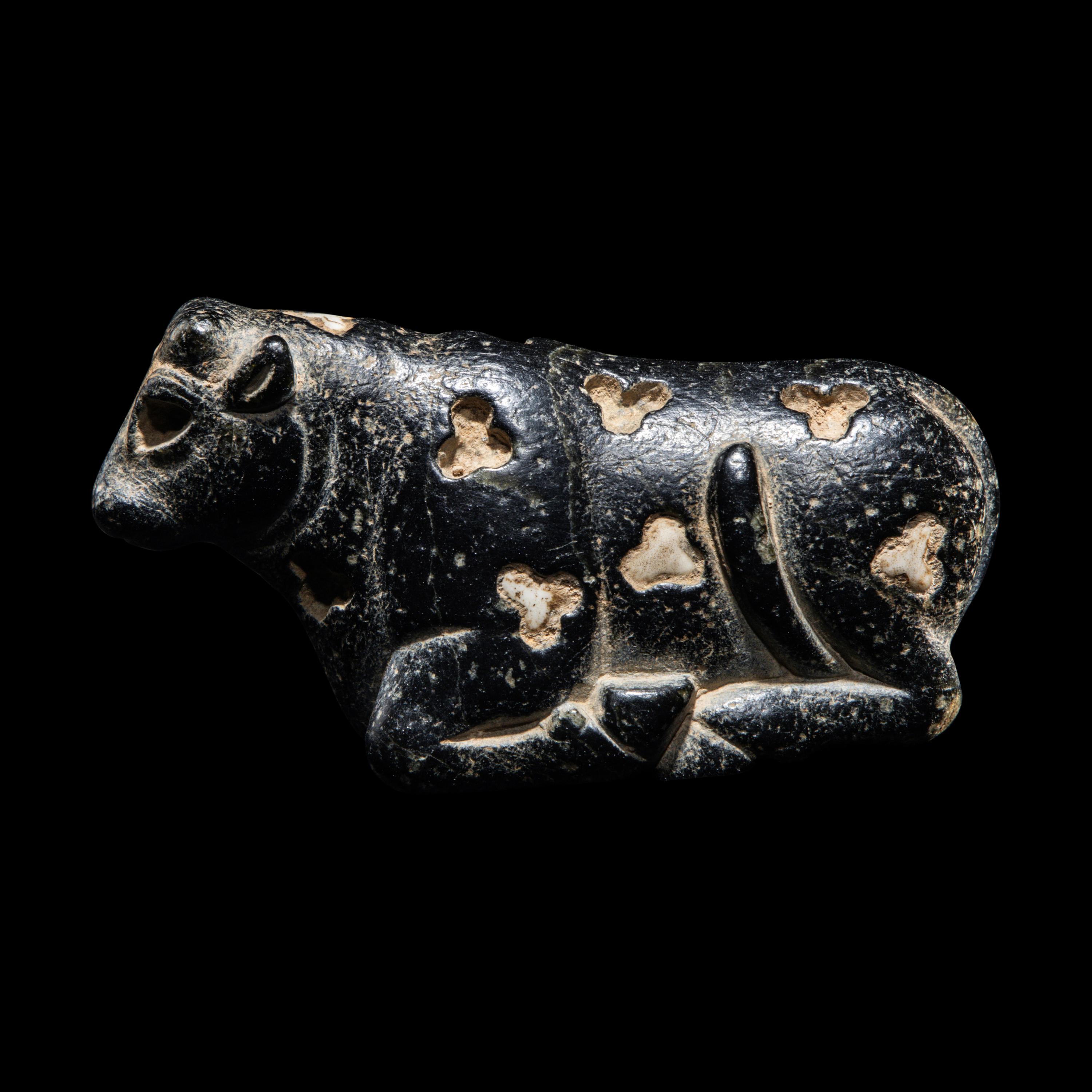 A Mesopotamian Marble and Limestone Inlay Recumbent Calf