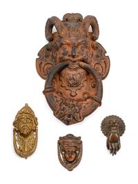 A Collection of Twelve Continental Bronze Door Knockers