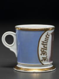 An Unusual Porcelain Shaving Mug Depicting an Icehouse