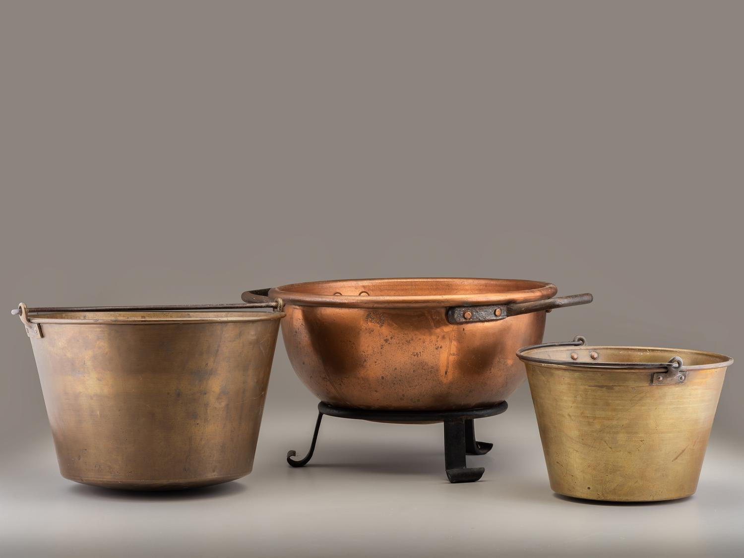 A Copper and Wrought Iron Bowl and Two Spun Brass Buckets