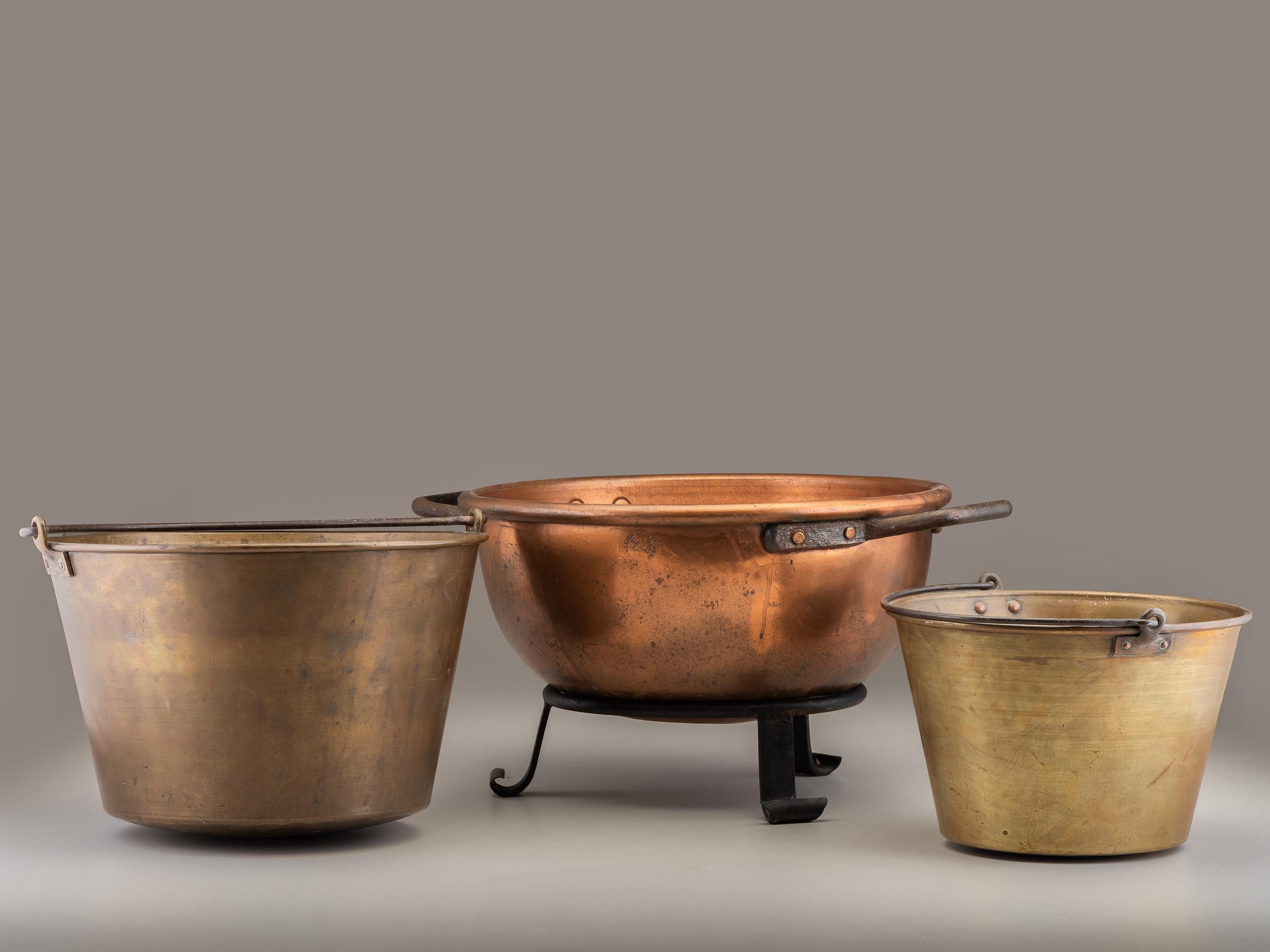 A Copper and Wrought Iron Bowl and Two Spun Brass Buckets
