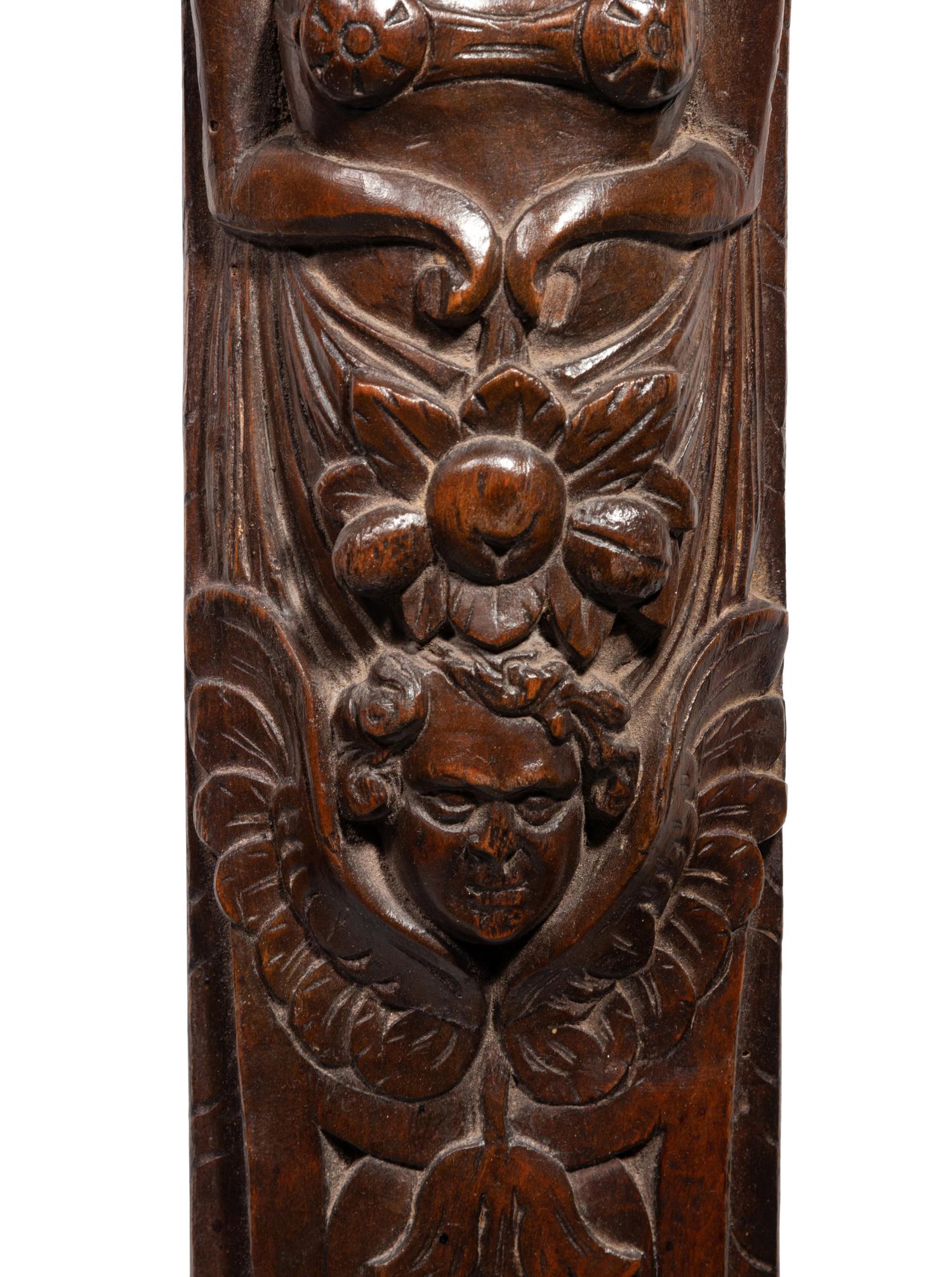 A Pair of Continental Carved Figural Pilasters