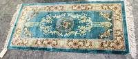 A Silk Rug 2 feet 3 inches x 4 feet 6 inches.
