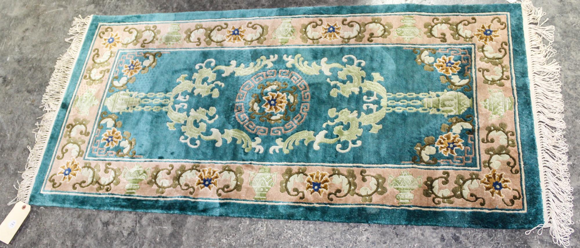 A Silk Rug 2 feet 3 inches x 4 feet 6 inches.
