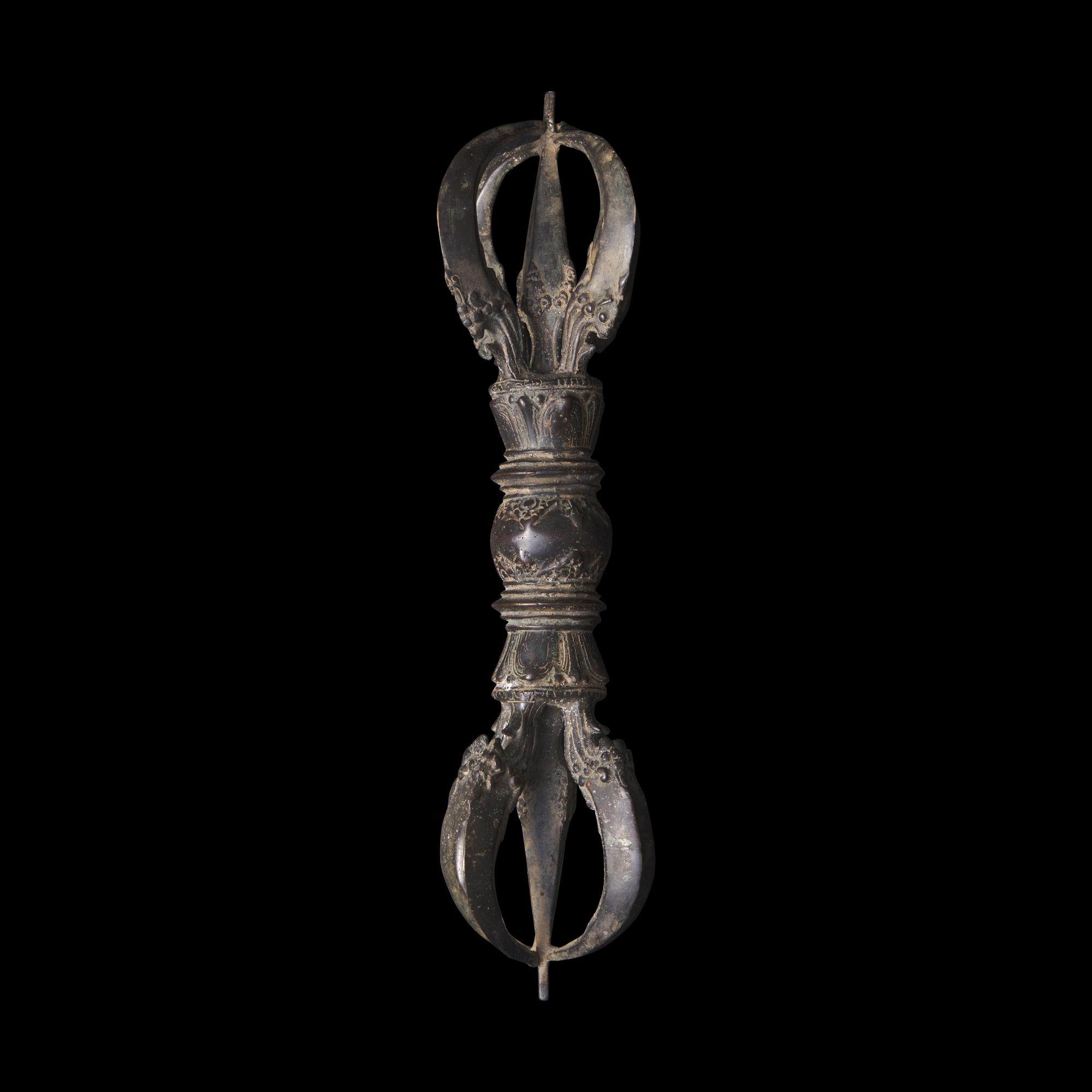 A Large Tibetan Patinated Bronze Vajra