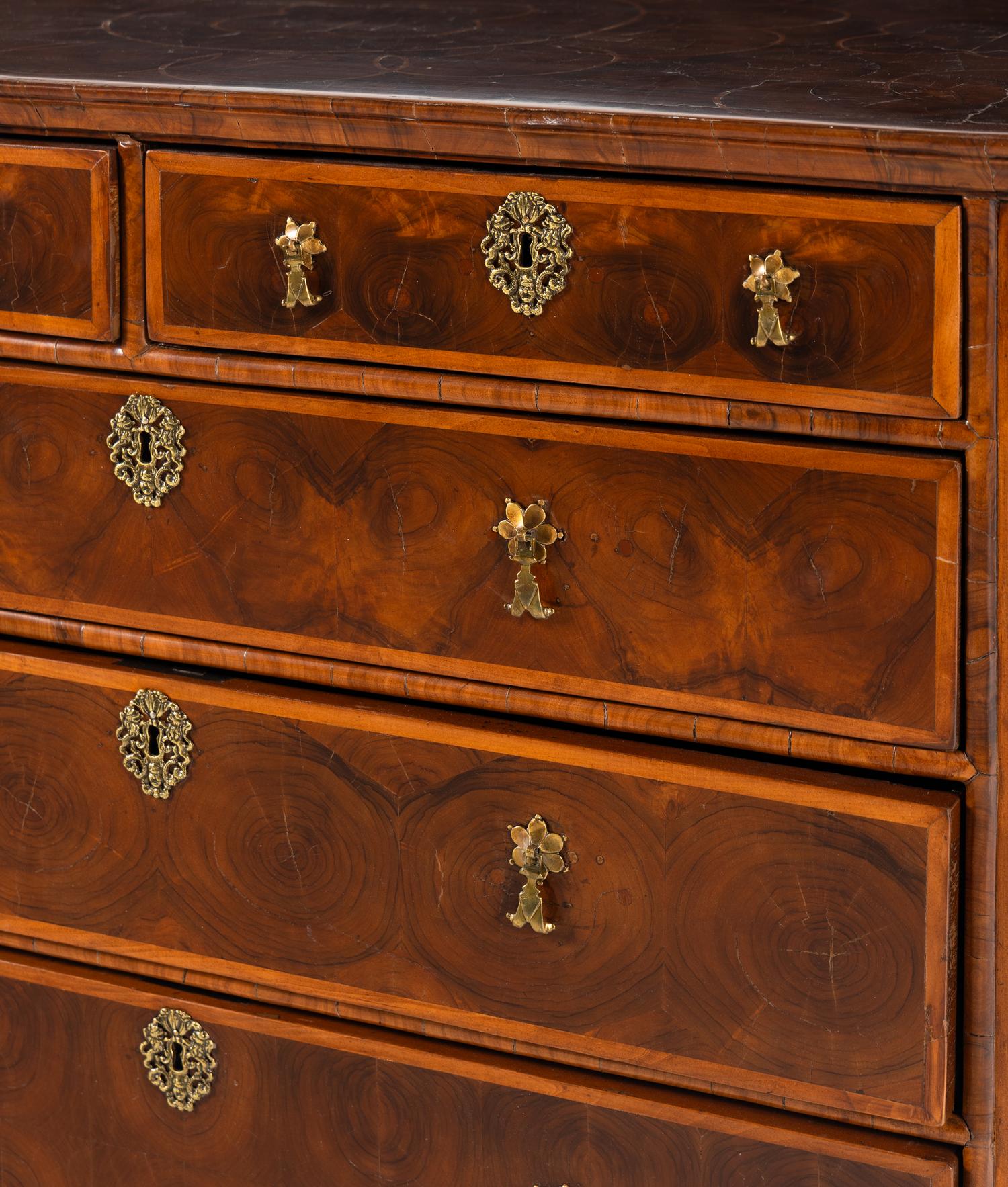 A William and Mary Oyster Walnut Chest of Drawers