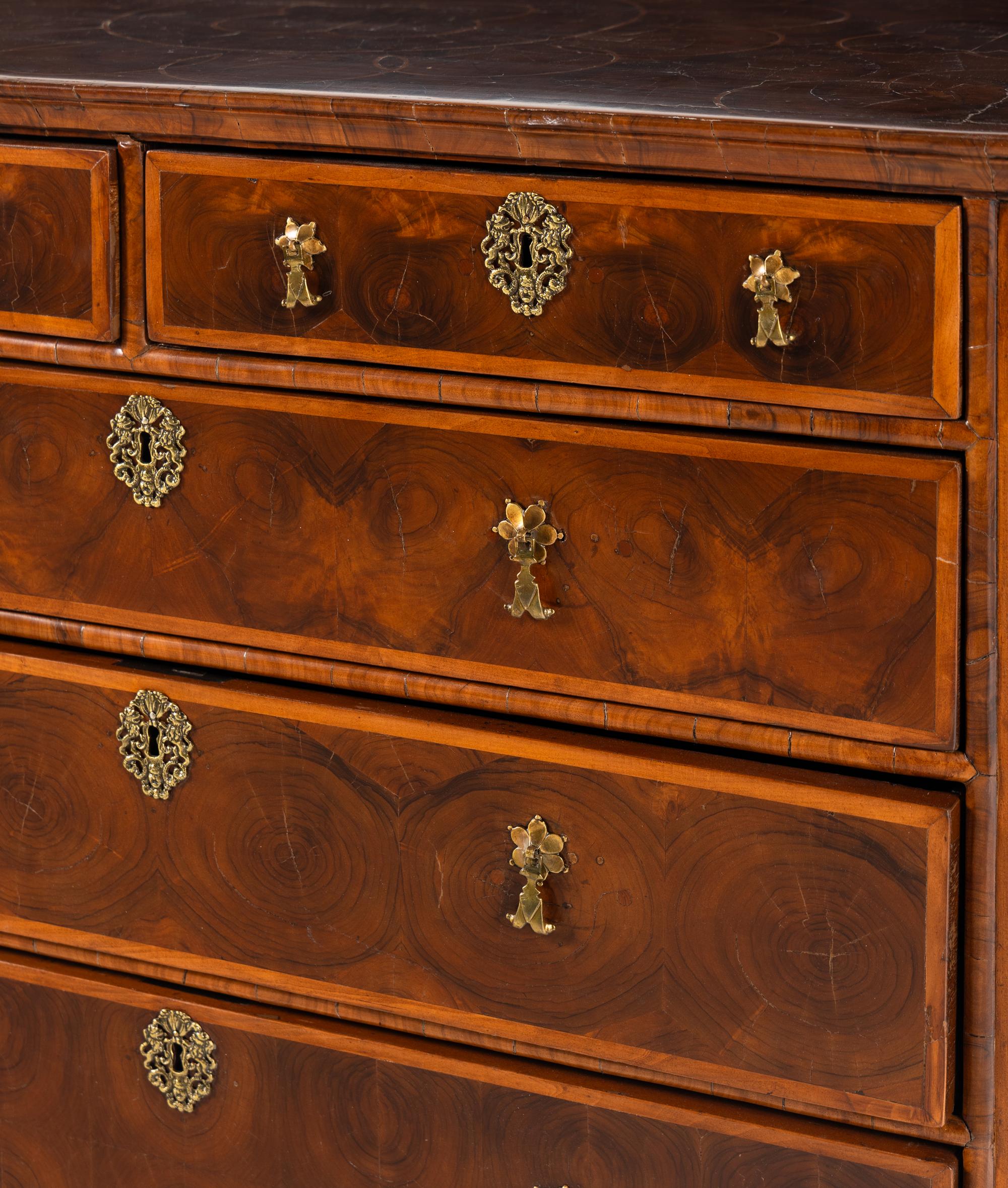 A William and Mary Oyster Walnut Chest of Drawers