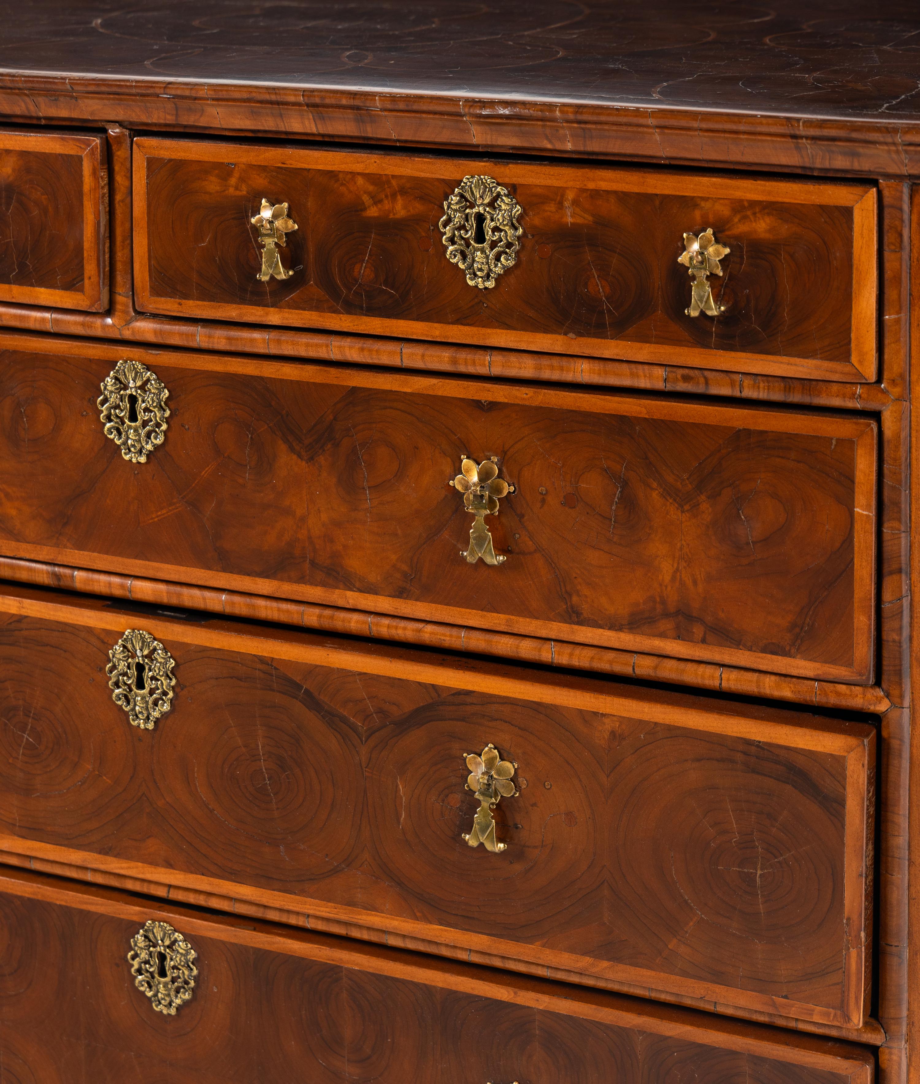 A William and Mary Oyster Walnut Chest of Drawers