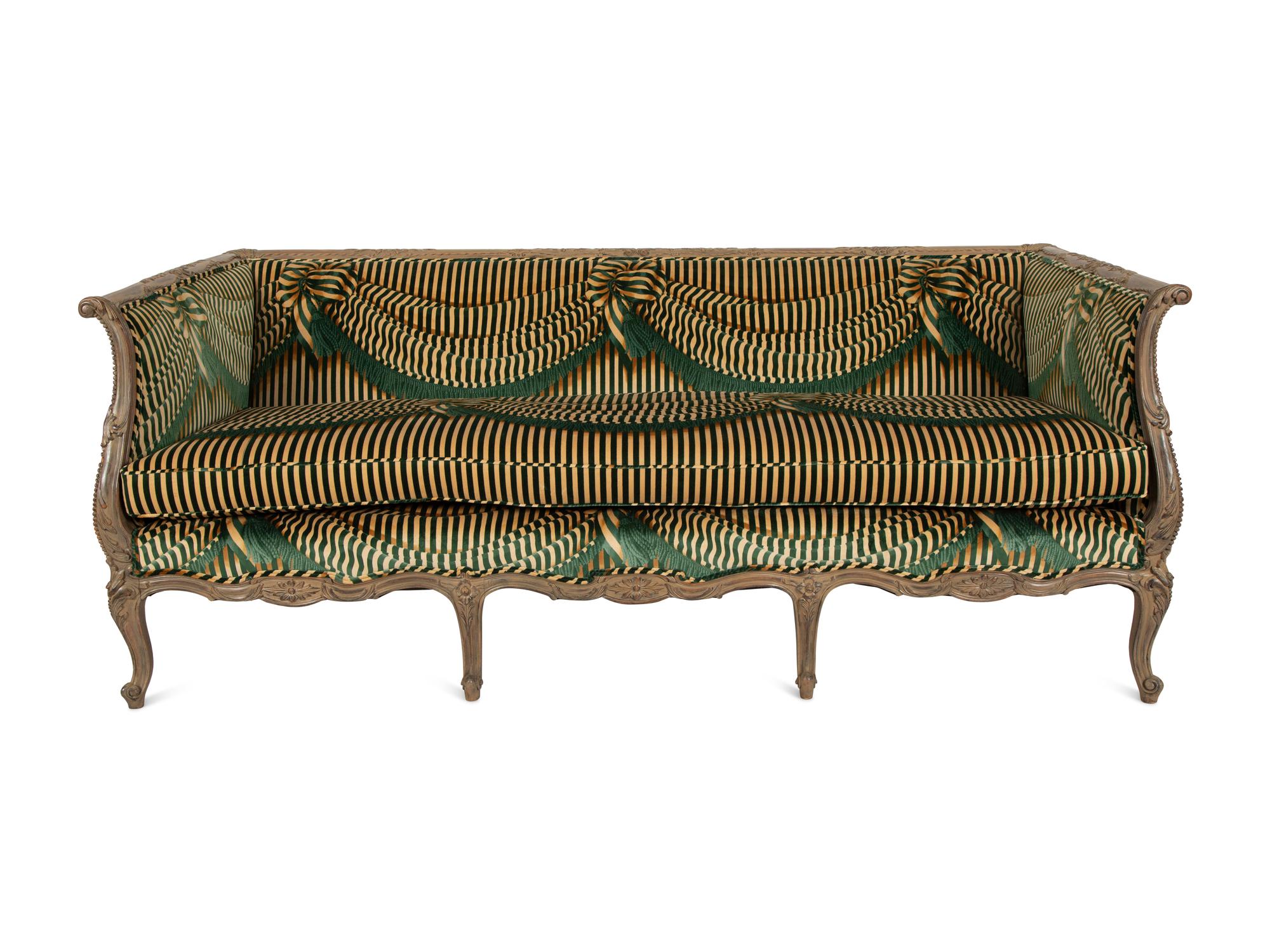 A Louis XV Style Carved and Stained Mahogany Sofa