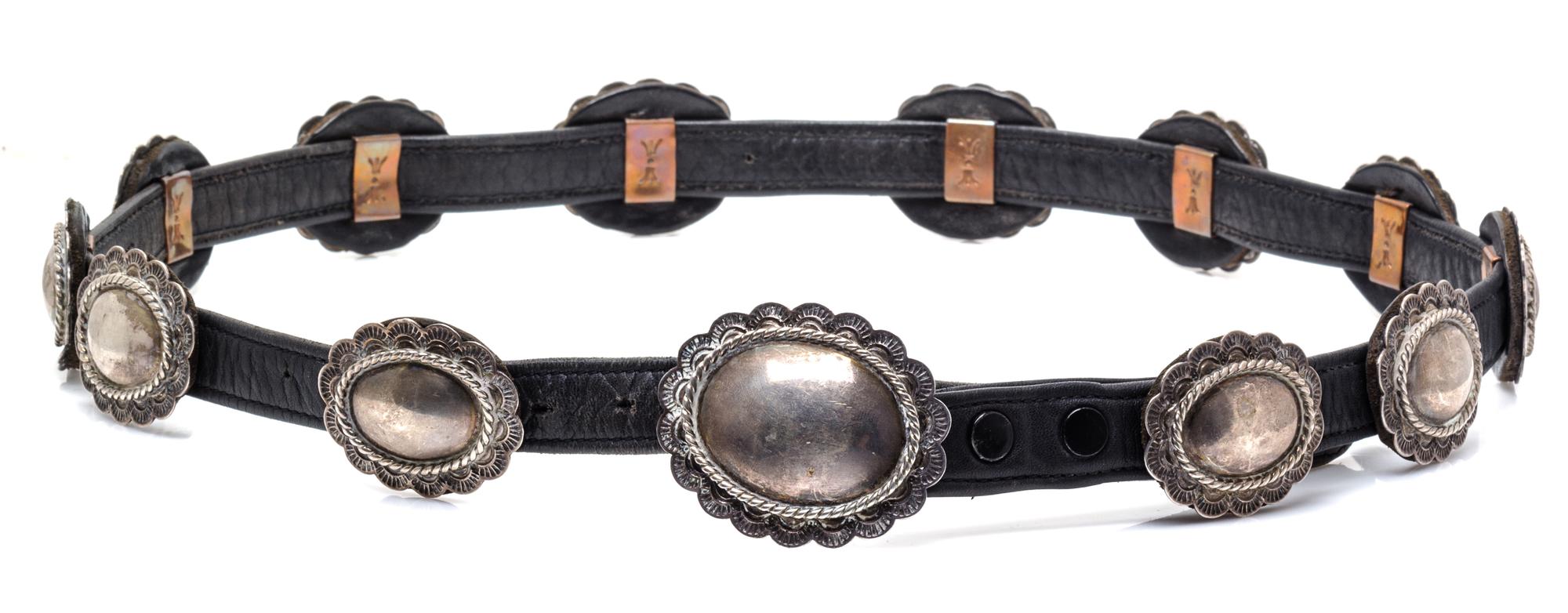 A Sterling Silver, Copper and Leather Concho Belt, Irv Paul, Navajo, 215.70 dwts. (including leather)