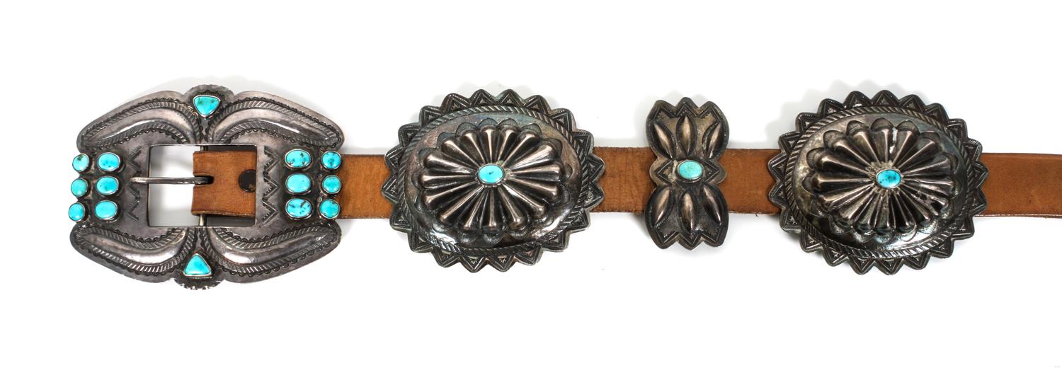 A Silver and Turquoise Concha Belt Length overall 41 inches; buckle height 3 x width 4 inches.