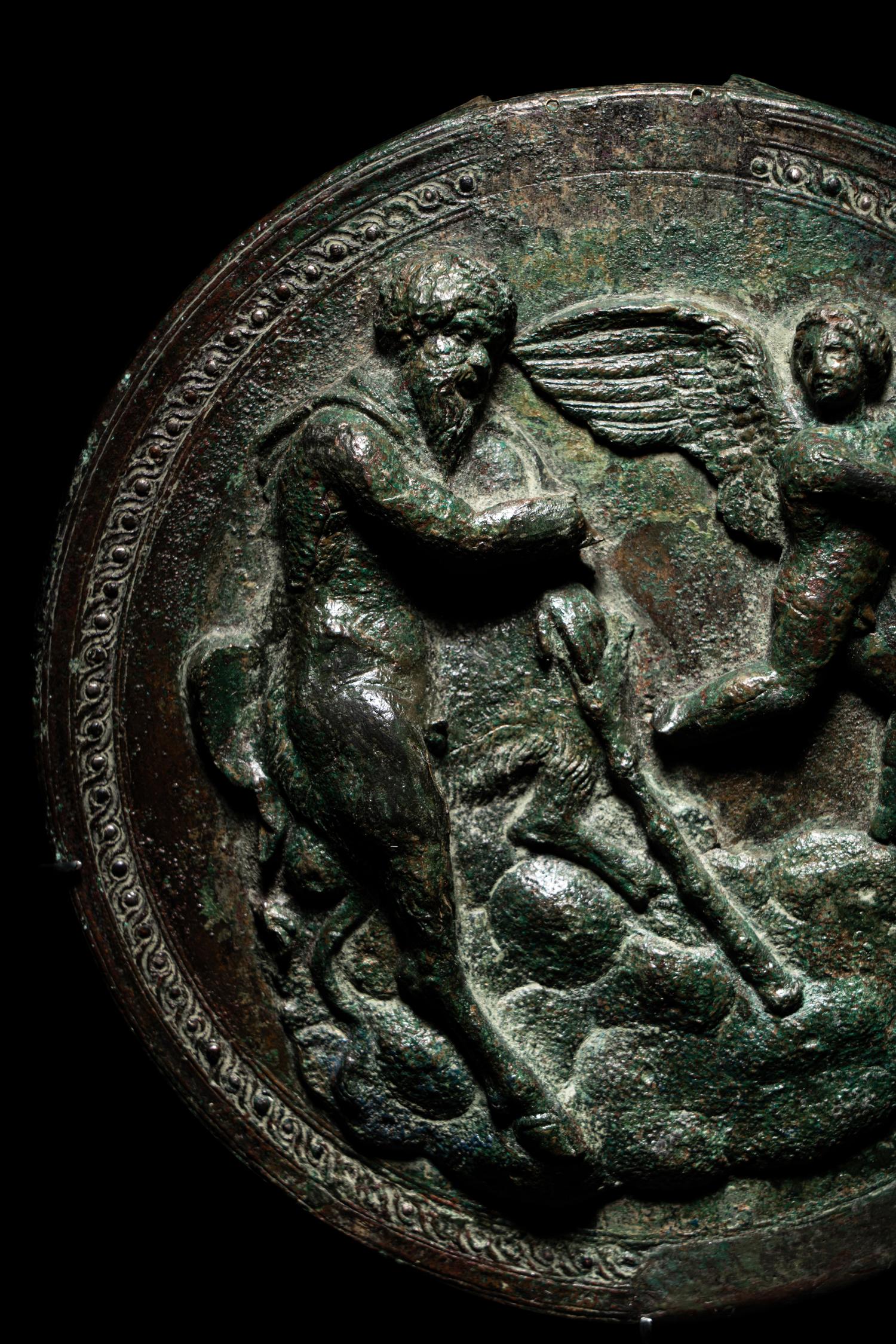 A Greek Bronze Box Mirror with Pan and Eros