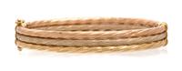 A 14 Karat Tricolor Gold Bangle Bracelet. 7.30 dwts.