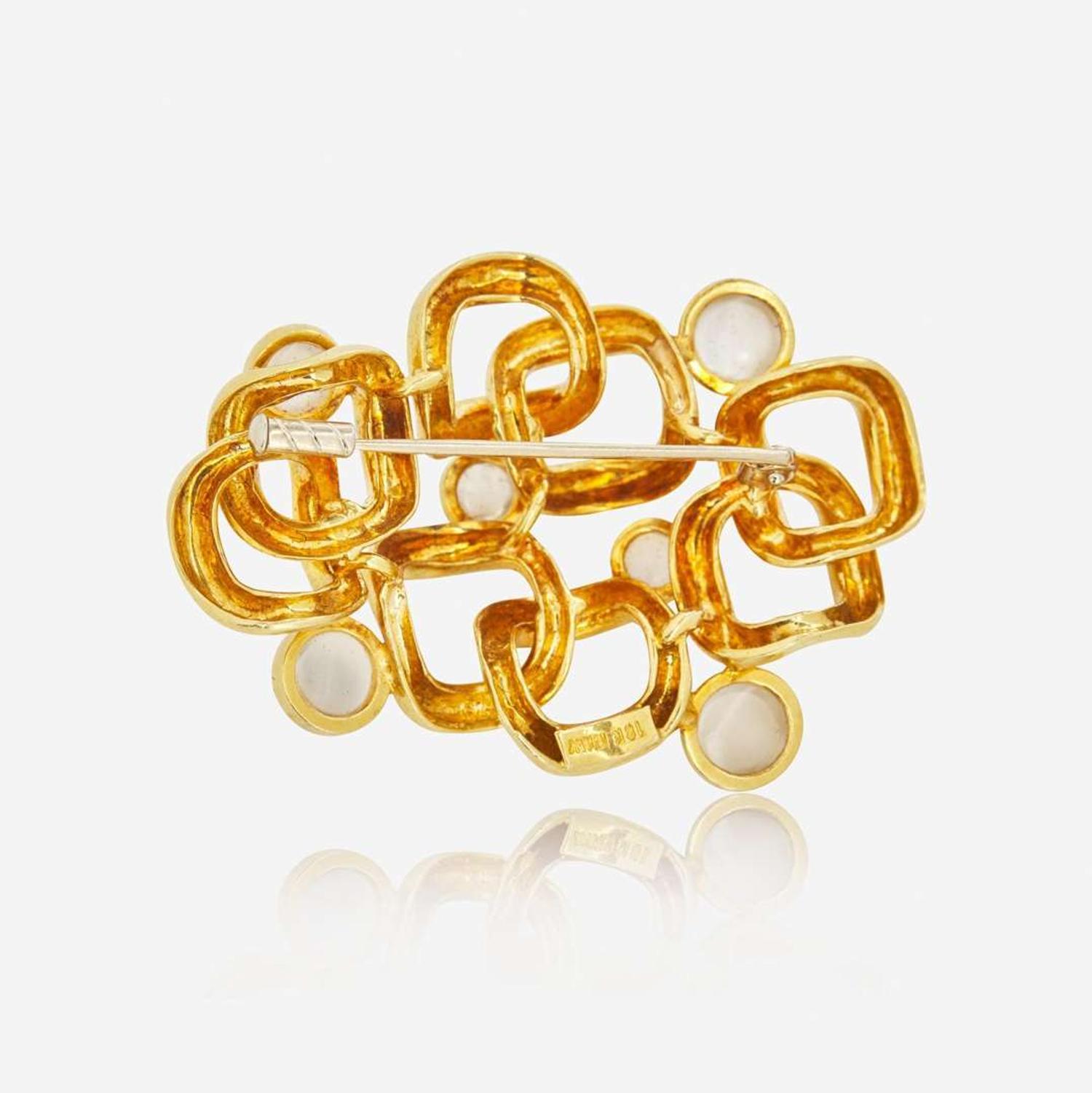 An 18K Yellow Gold and Moonstone Brooch