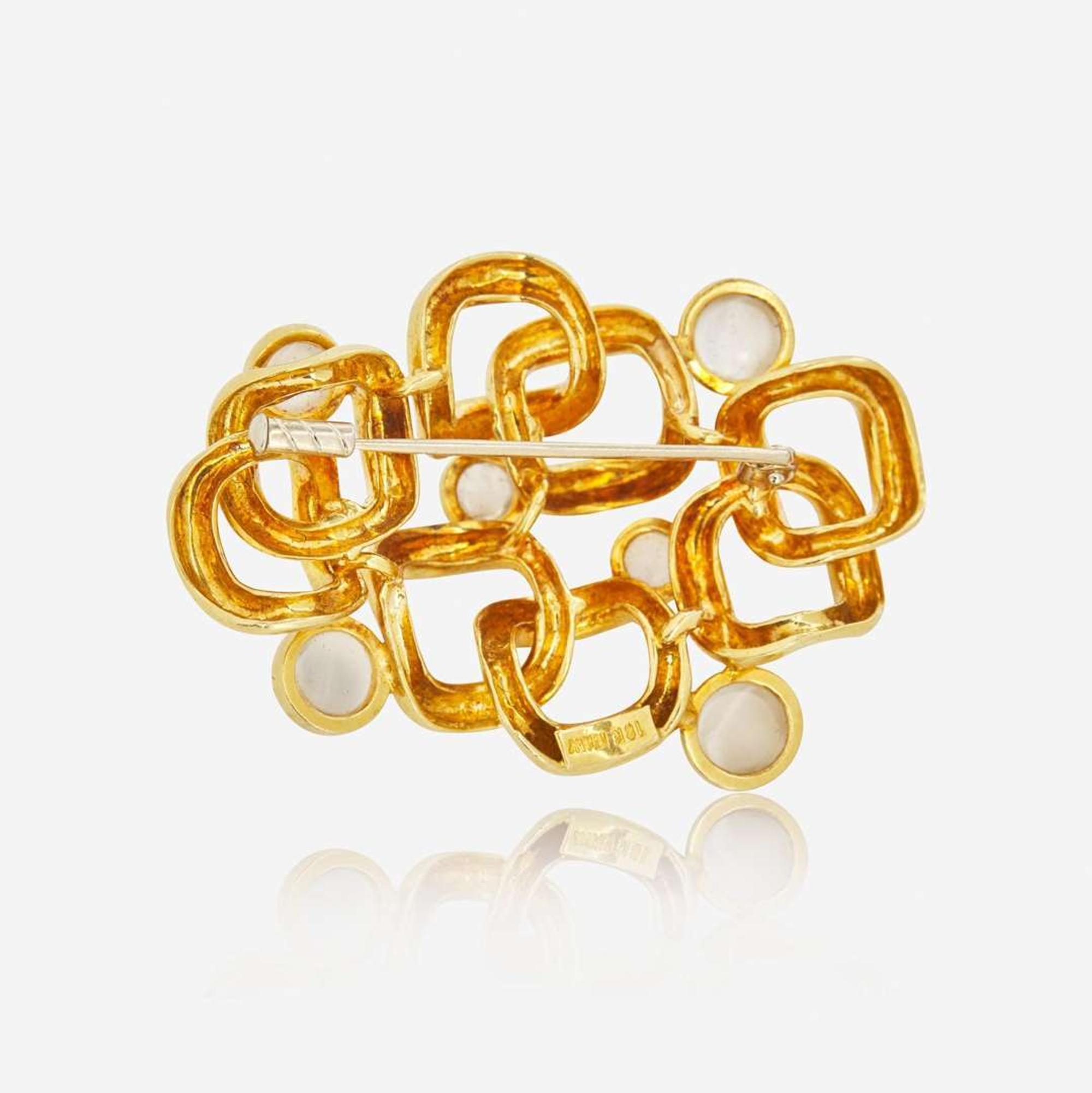 An 18K Yellow Gold and Moonstone Brooch