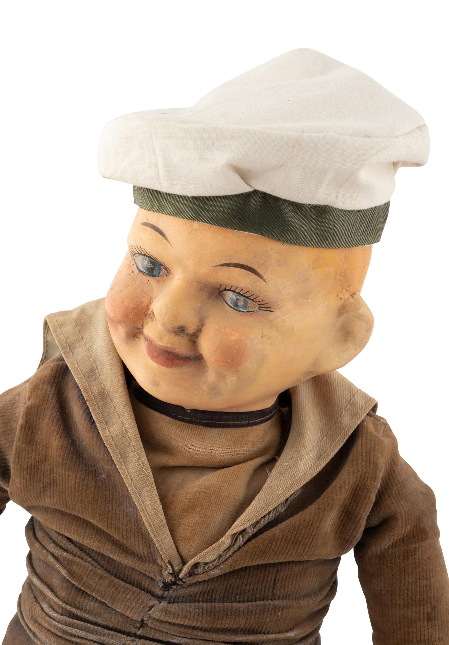A Group of Squeezer Dolls and Other Toys