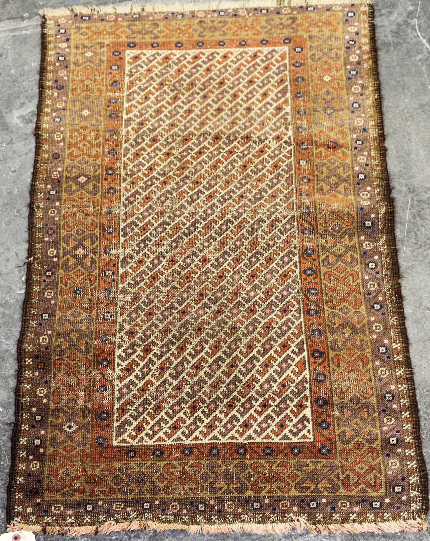 A Caucasian Wool Rug 3 feet 10 inches x 2 feet 3 inches. — EARLY 20TH CENTURY