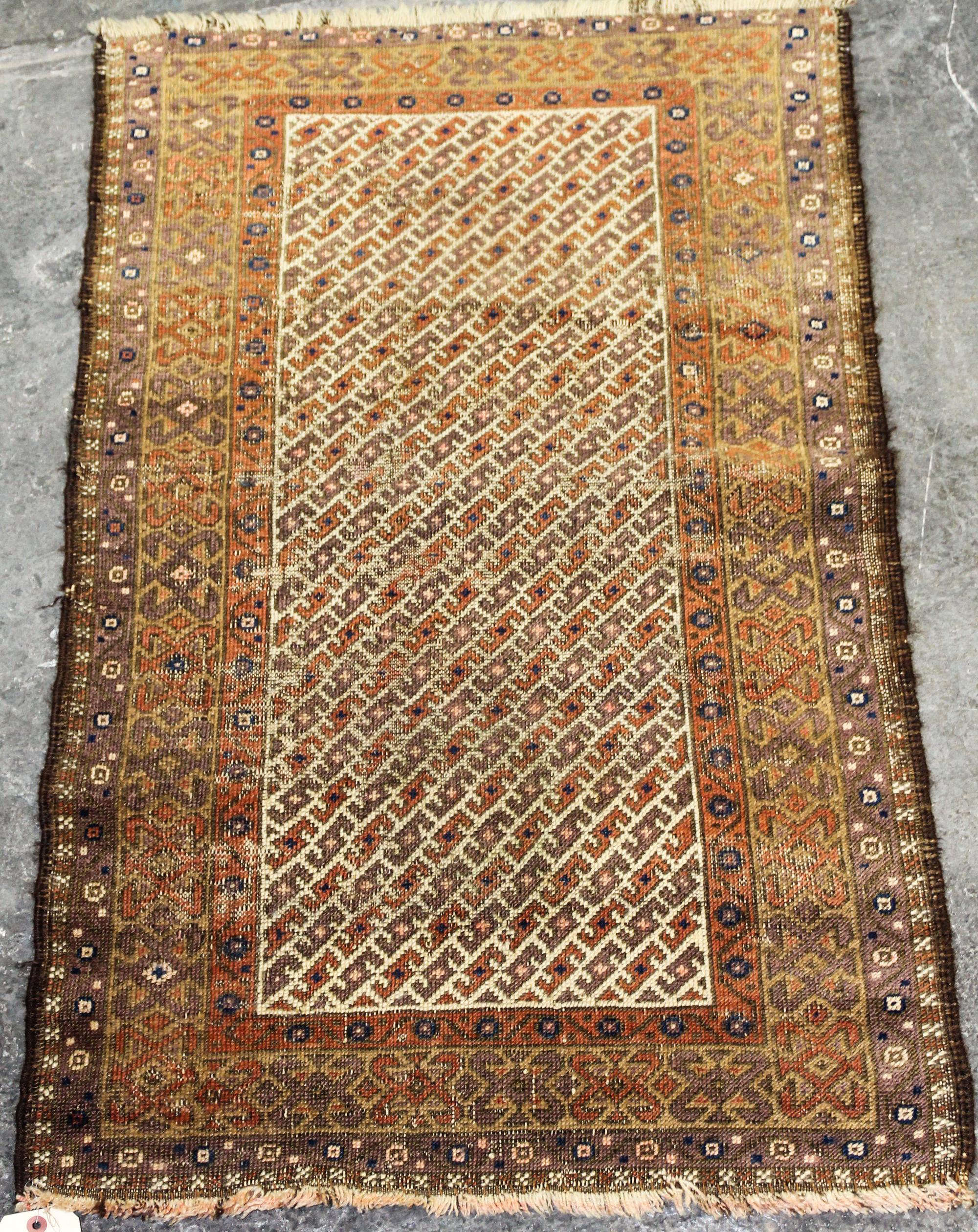 A Caucasian Wool Rug 3 feet 10 inches x 2 feet 3 inches. — EARLY 20TH CENTURY