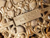 A Gianni Versace Runway Greco Link and Crystal Heart Belt, Chain Lengths: 29.25"- 32.50"; Heart: 3.5" x 3.25"; Cross 3" x 4.25".