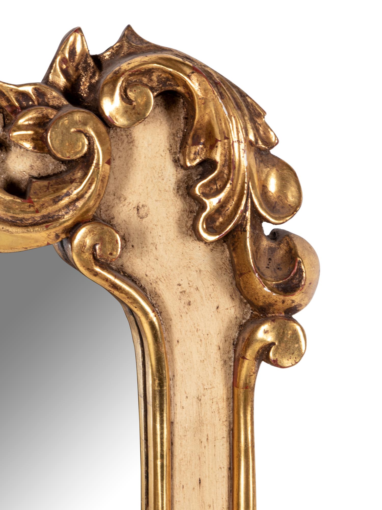 A Painted and Parcel Giltwood Mirror