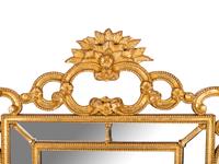 An Italian Baroque Style Giltwood Mirror