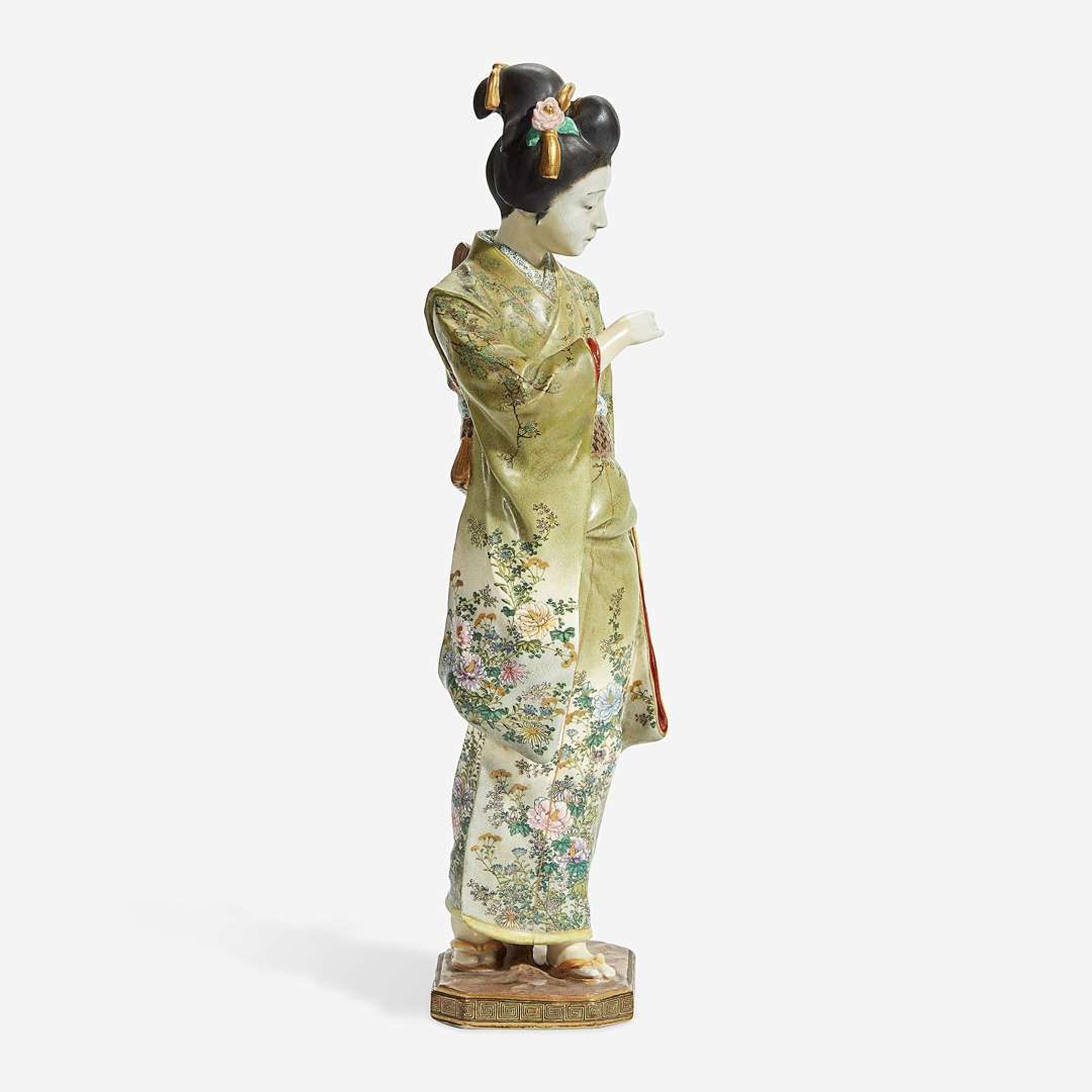 A Japanese enameled Satsuma-type pottery figure of a bijin, Kinkozan studios late 19th/early 20th Century