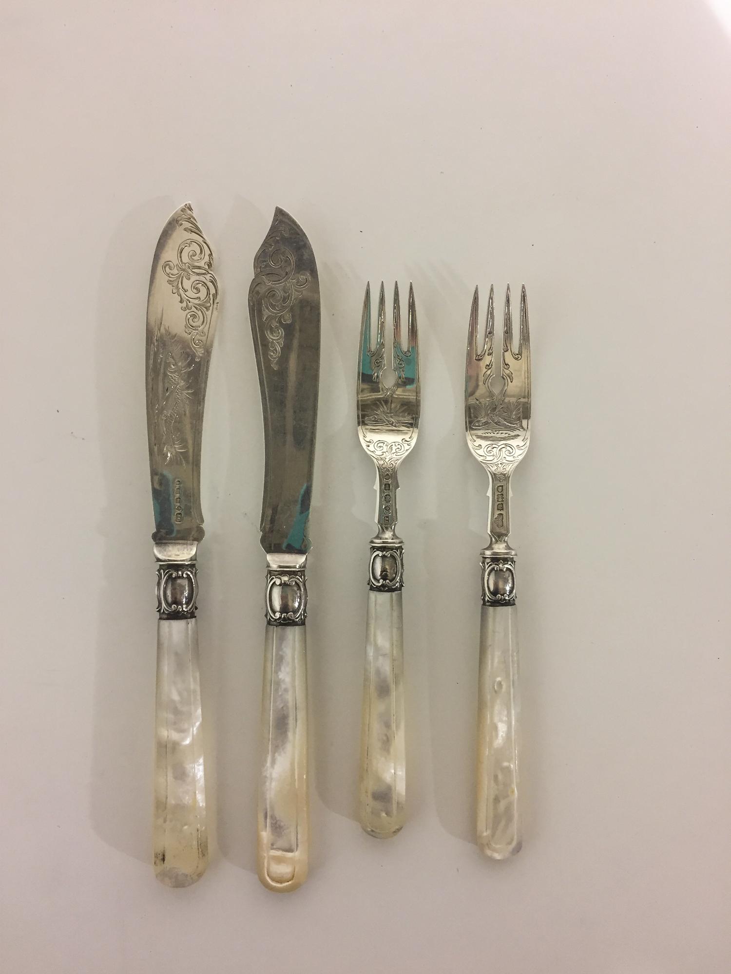 A Victorian Silver Fish Service, , with mother-of-pearl handles and engraved sea motifs, comprising: 6 knives, John Gilbert, Birmingham