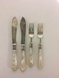 A Victorian Silver Fish Service, , with mother-of-pearl handles and engraved sea motifs, comprising: 6 knives, John Gilbert, Birmingham
